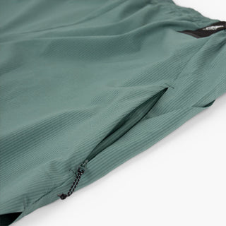 detail view of the hidden side zip pocket of the ciele athletics WRKShort unisex running and technical short from the Lifestyle Edition collection, in silver pine color