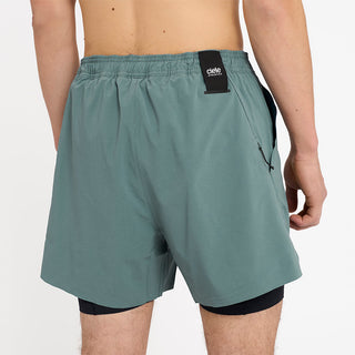 close back view of ciele athletics WRKShort unisex running and technical short from the Lifestyle Edition collection, in silver pine color, on a model