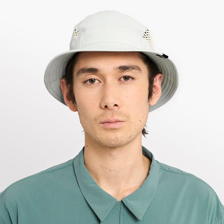 front view of ciele athletics GOBucket unisex running bucket hat from the Lifestyle Edition collection, in light grey color, on a model