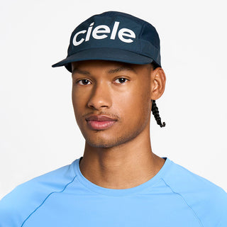 front view of the ciele athletics GOCap unisex running hat in deep space color, on a model