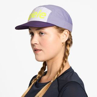 side view of the ciele athletics GOCap unisex running hat in misty lilac color, on a model