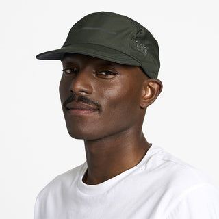 side view of ciele athletics GOCap Comp Bars unisex running hat in dark ochre color on a model