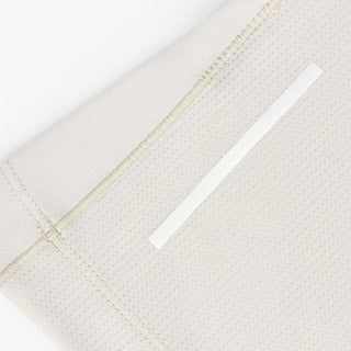 close view of the back reflective detail on the ciele athletics DLYTSinglet lightweight and performance driven singlet in rainy day