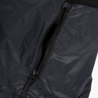 closeup view of the zippered side pocket of the ciele athletics VNTJacket lightweight running jacket for men in shadowcast color