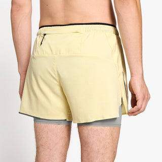 close back view of ciele athletics DLYShort 5 inch with a long brief in glade color on a model