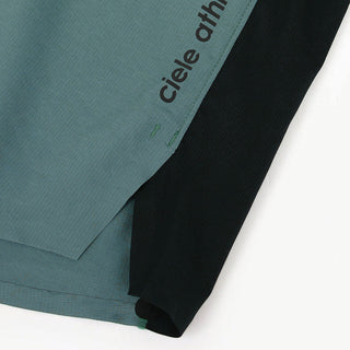 close view of the logo and fabric on the ciele athletics TRNShort 7 inch linerless short in silver pine color