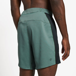 close back view of ciele athletics TRNShort 7 inch linerless short in silver pine color on a model