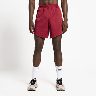 front view of ciele athletics TRNShort 7 inch linerless short in merlot color on a model