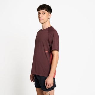 side view of ciele athletics DLYTShirt lightweight and performance driven T-Shirt in dark wine red on a model