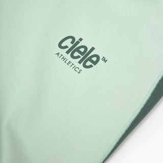 close view of the reflective logo on the ciele athletics DLYTshirt lightweight and performance driven T-Shirt in dusty turquoise