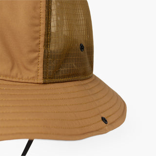 closeup view of the ciele athletics TRLBucket unisex running bucket hat side button closure in dark ochre color