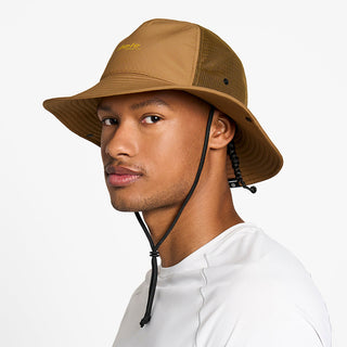 side view of the ciele athletics TRLBucket unisex running bucket hat in dark ochre color, on a model