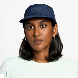 front view of the ciele athletics GOCap unisex running hat in deep space color, on a model
