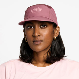 front view of the ciele athletics GOCap unisex running hat in deco rose color, on a model