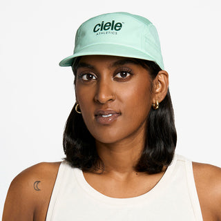 front view of the ciele athletics GOCap unisex running hat in dusty turquoise color, on a model