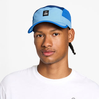 front view of the ciele athletics GOCap unisex running hat with a curved brim in dusty blue color, on a model