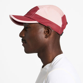 side view of ciele athletics GOCap C Classic C Plus Box unisex running hat in merlot peachskin color on a model