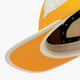 back view of ciele athletics GOCap Field Iconic Bar unisex running hat in clementine sand color