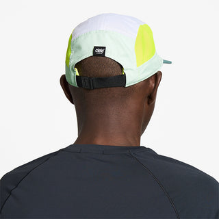 back view of ciele athletics GOCap Field Iconic Bar unisex running hat in dusty turquoise white color on a model