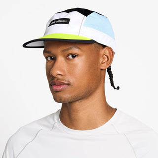 front view of the ciele athletics GOCap unisex running hat in black and white color, on a model