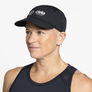 side view of ciele athletics FSTCap SC Classic C Side unisex running hat in whitaker color on a model