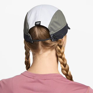 back view of ciele athletics FSTCap SC Field Iconic SL unisex running hat in whitaker color on a model