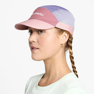 side view of ciele athletics FSTCap SC Field Iconic SL unisex running hat in deco rose light grape color on a model