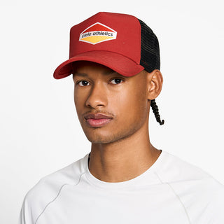 front view of the ciele athletics TRLCap unisex running hat with a curved brim in clay color, on a model