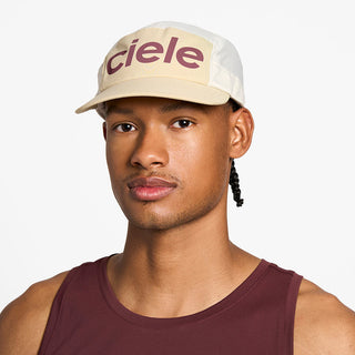 front view of the ciele athletics GOCap unisex running hat in safari color, on a model