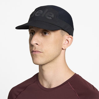 side view of ciele athletics GOCap Comp Century unisex running hat in shadowcast color on a model