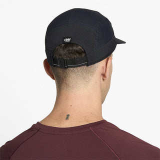 back view of ciele athletics GOCap Comp Century unisex running hat in shadowcast color on a model