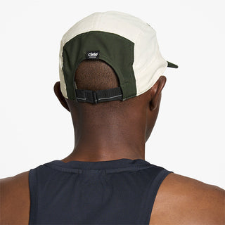 back view of ciele athletics GOCap Comp Century unisex running hat in seaweed rainy day color on a model