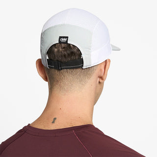 back view of ciele athletics GOCap Comp Century unisex running hat in lightgrey white color on a model