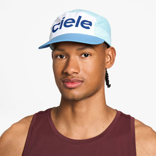 front view of the ciele athletics GOCap unisex running hat in white sky blue color, on a model