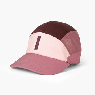 front view of the ciele athletics FTSCap unisex running hat with a curved brim in peachskin color