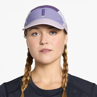 front view of ciele athletics FSTCap SC Comp Iconic VC unisex running hat in light grape color on a model