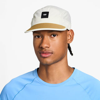side view of the ciele athletics GOCap unisex running hat in rainy day color, on a model