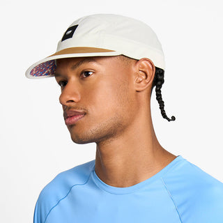 front view of the ciele athletics GOCap unisex running hat in rainy day color, on a model