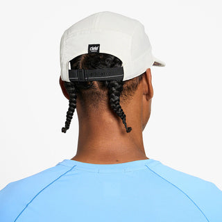 back view of the ciele athletics GOCap unisex running hat in rainy day color, on a model