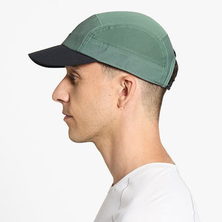 side view of ciele athletics GOCap Comp C cube unisex running hat in silver pine color on a model