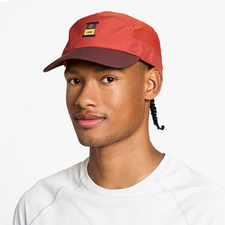 front view of the ciele athletics GOCap with a curved brim unisex running hat in clay color, on a model