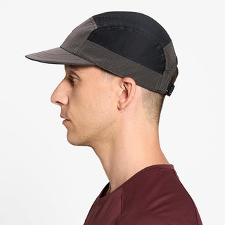 side view of ciele athletics GOCap Icon Circle C unisex running hat in shadowcast color on a model