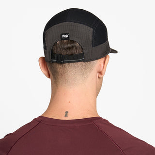 back view of ciele athletics GOCap Icon Circle C unisex running hat in shadowcast color on a model