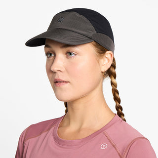 side view of ciele athletics FSTCap Icon Circle C unisex running hat in shadowcast color on a model