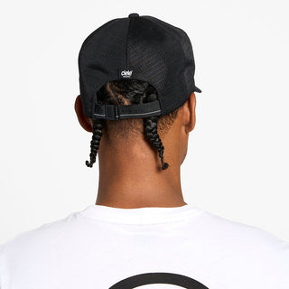 back view of the ciele athletics TRLCap unisex running hat with a curved brim in shadowcast color, on a model