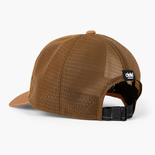 back view of the ciele athletics TRLCap unisex running hat with a curved brim in dark ochre color