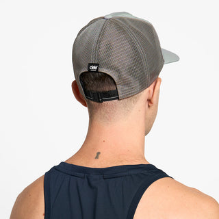 back view of ciele athletics TRLCap SC Comp unisex running hat in neutral grey color on a model