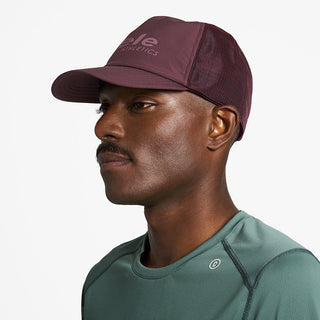 side view of ciele athletics TRLCap SC Comp unisex running hat in dark wine red color on a model