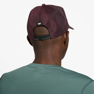 back view of ciele athletics TRLCap SC Comp unisex running hat in dark wine red color on a model