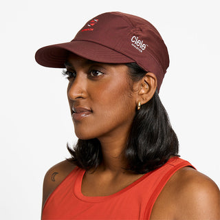 side view of ciele athletics GOCap SC Comp Word Wild Mouvement unisex running hat for the London marathon on a model